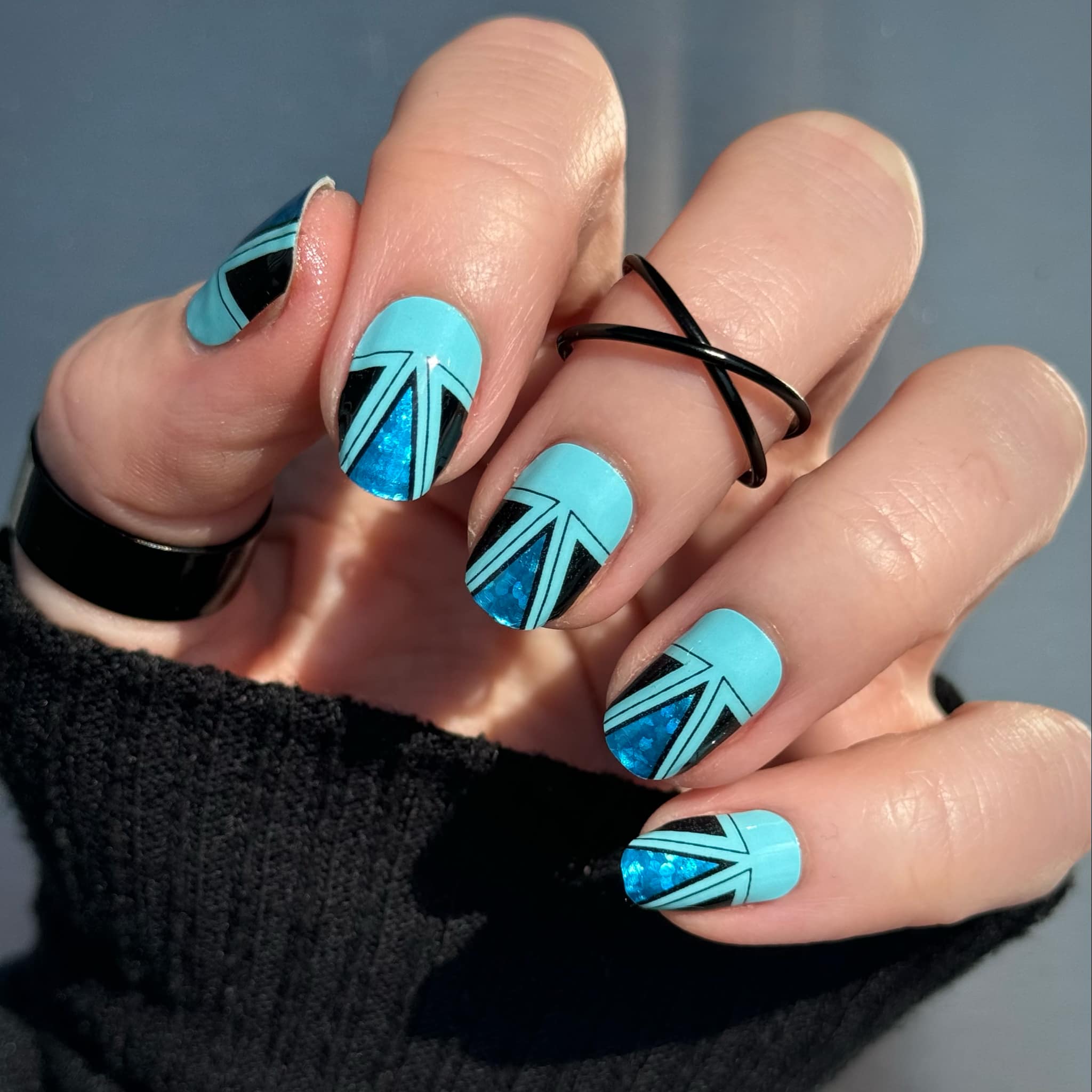 Black Geometric Nail Art That Shines
